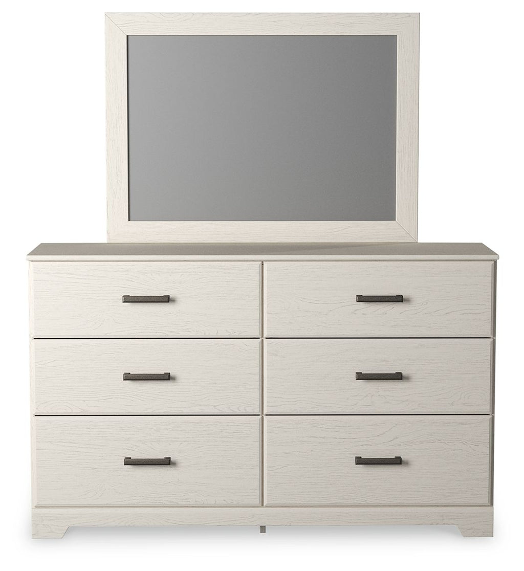 White dresser with mounted mirror and six drawers with black bar pulls