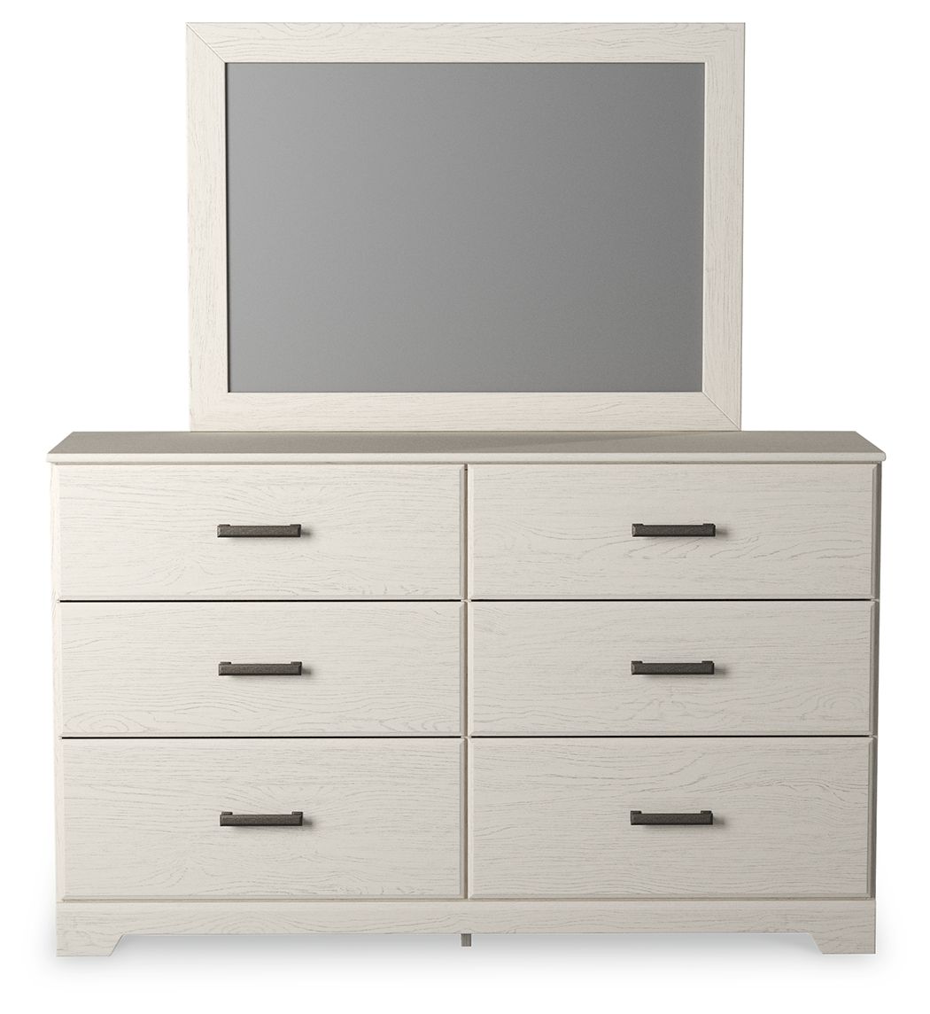 White dresser with mounted mirror and six drawers with black bar pulls