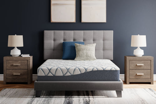 10-inch firm mattress in bed frame, white and blue patterned top with pillows