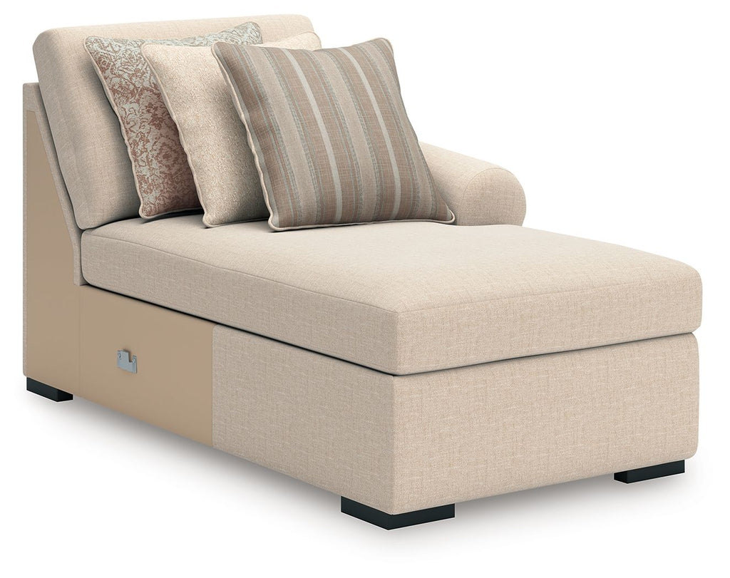 Beige chaise sectional seat with three back pillows and dark base feet