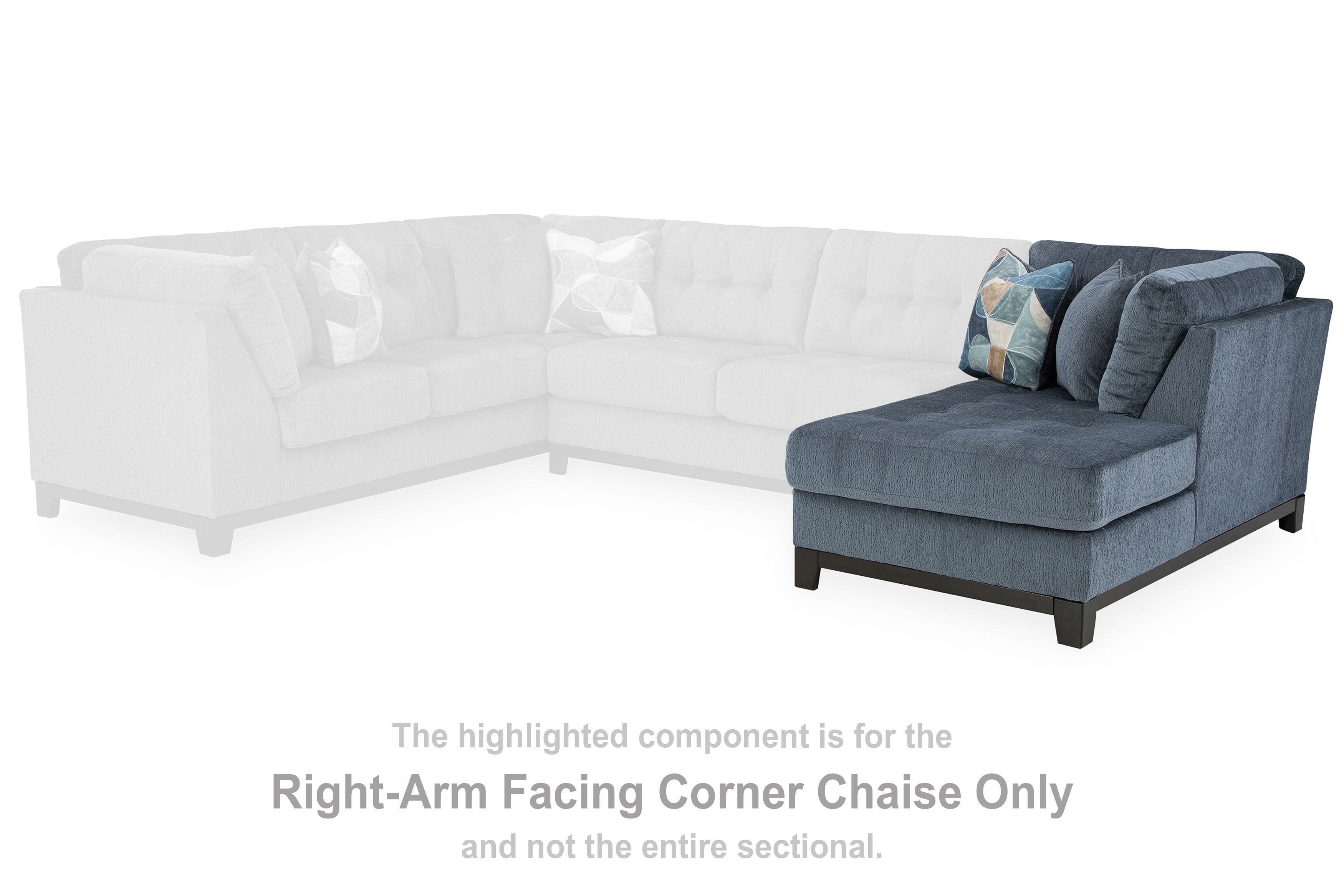 Navy corner chaise section with two throw pillows, dark wood legs
