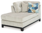 Stone fabric corner chaise with left arm, tufted back, geometric throw pillow, dark legs