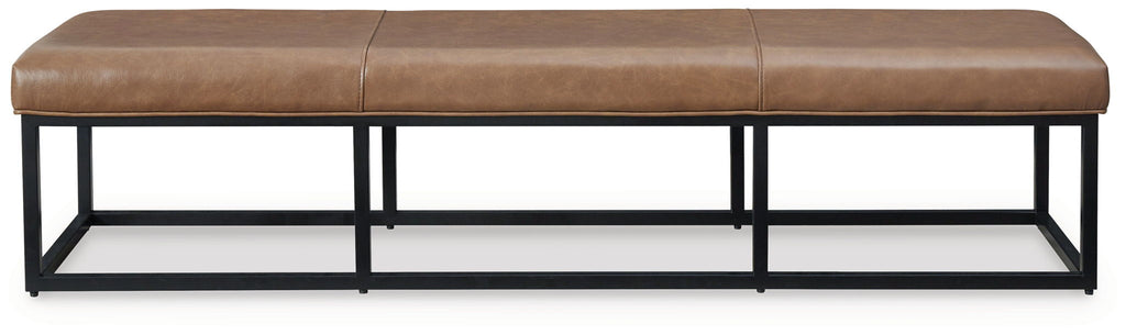 Low caramel brown bench with padded top and black steel base, side view