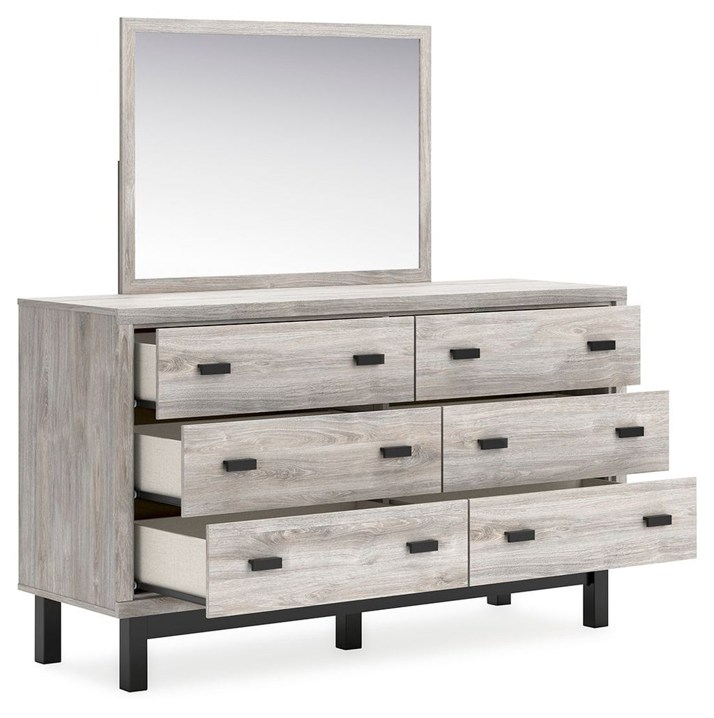 Gray dresser with mirror, three drawers extended, black bar pulls, wood-look finish