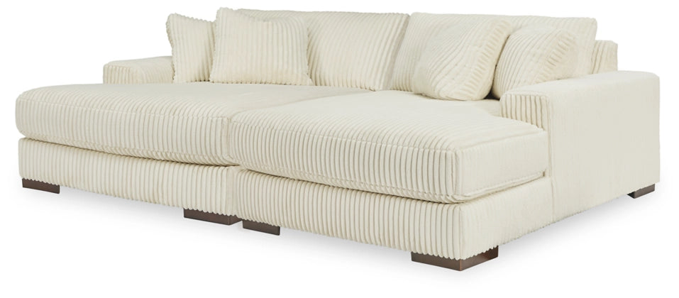Ivory sectional sofa chaise with thick box seat cushions and track arms