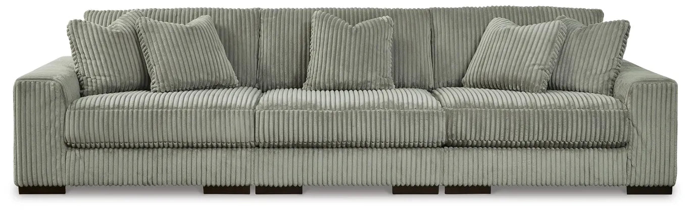 Fog gray sectional sofa with wide seat and ribbed cord upholstery, rounded arms