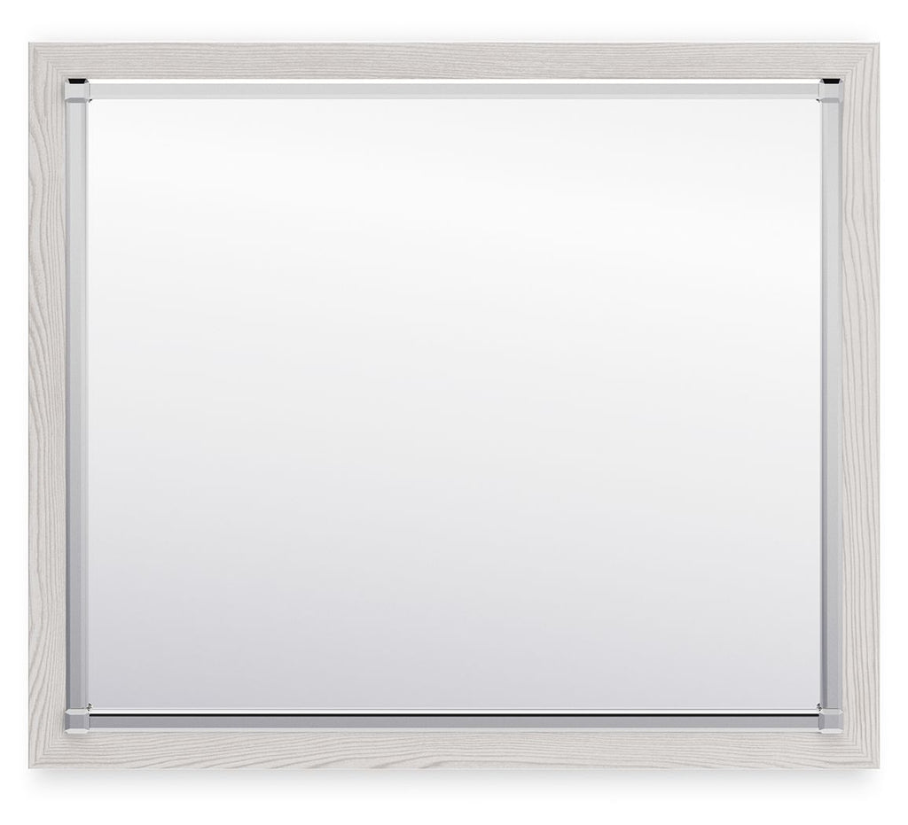 Bedroom mirror with light wood frame, silver corners and smooth glass surface