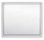 Bedroom mirror with light wood frame, silver corners and smooth glass surface