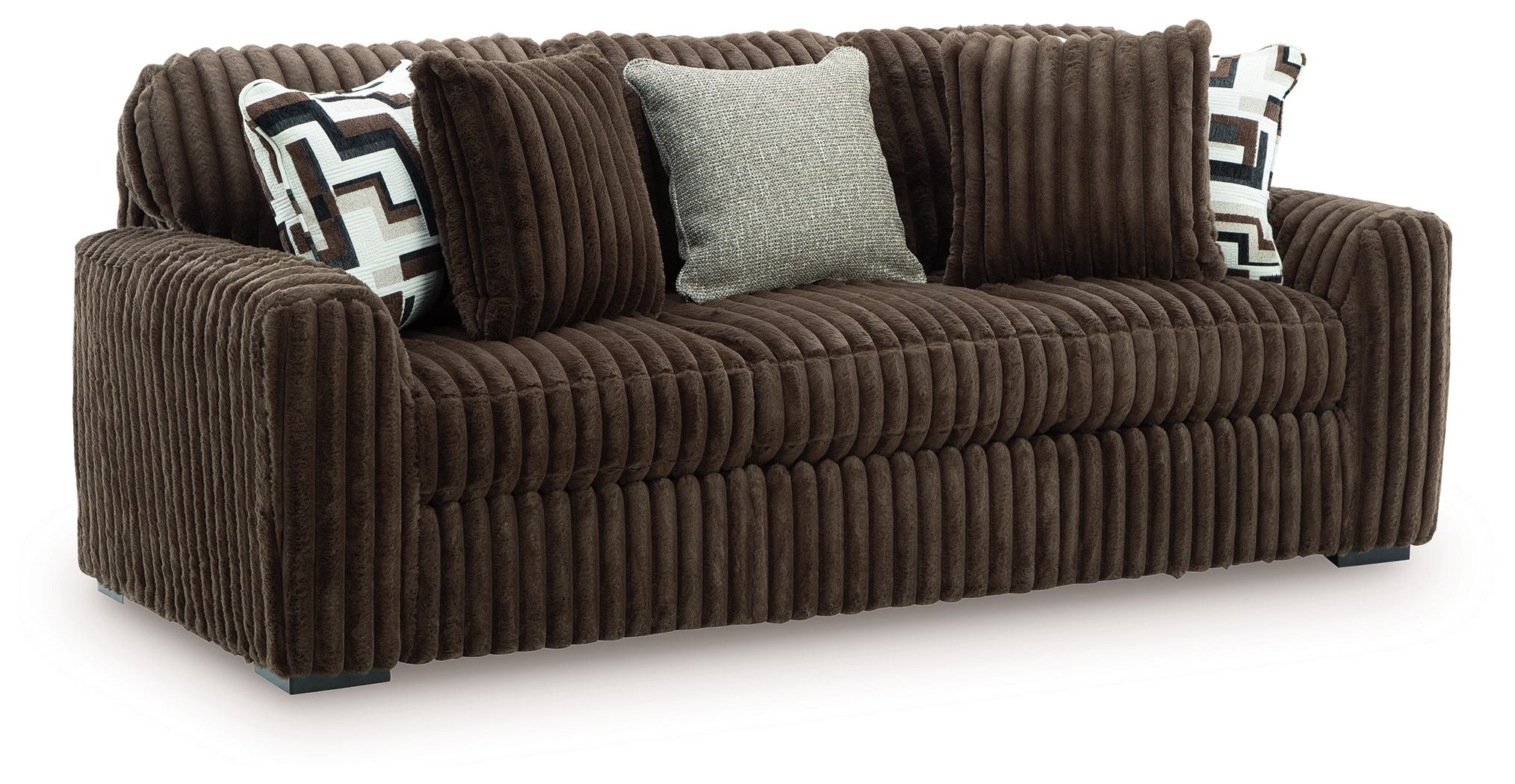 Dark brown corduroy sofa with plush cushions and patterned throw pillows, square light accent pillow