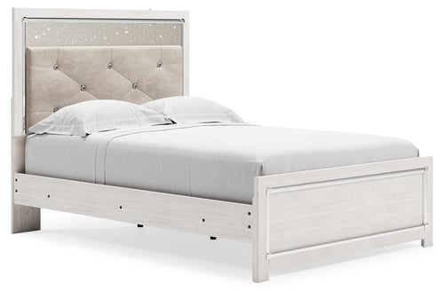 White panel bed with light gray upholstered headboard and footboard drawer storage.