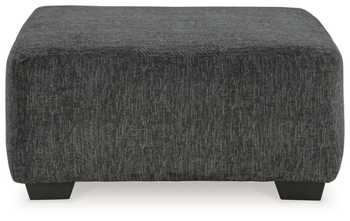 Oversized accent ottoman, dark gray textured fabric, square profile, short block legs
