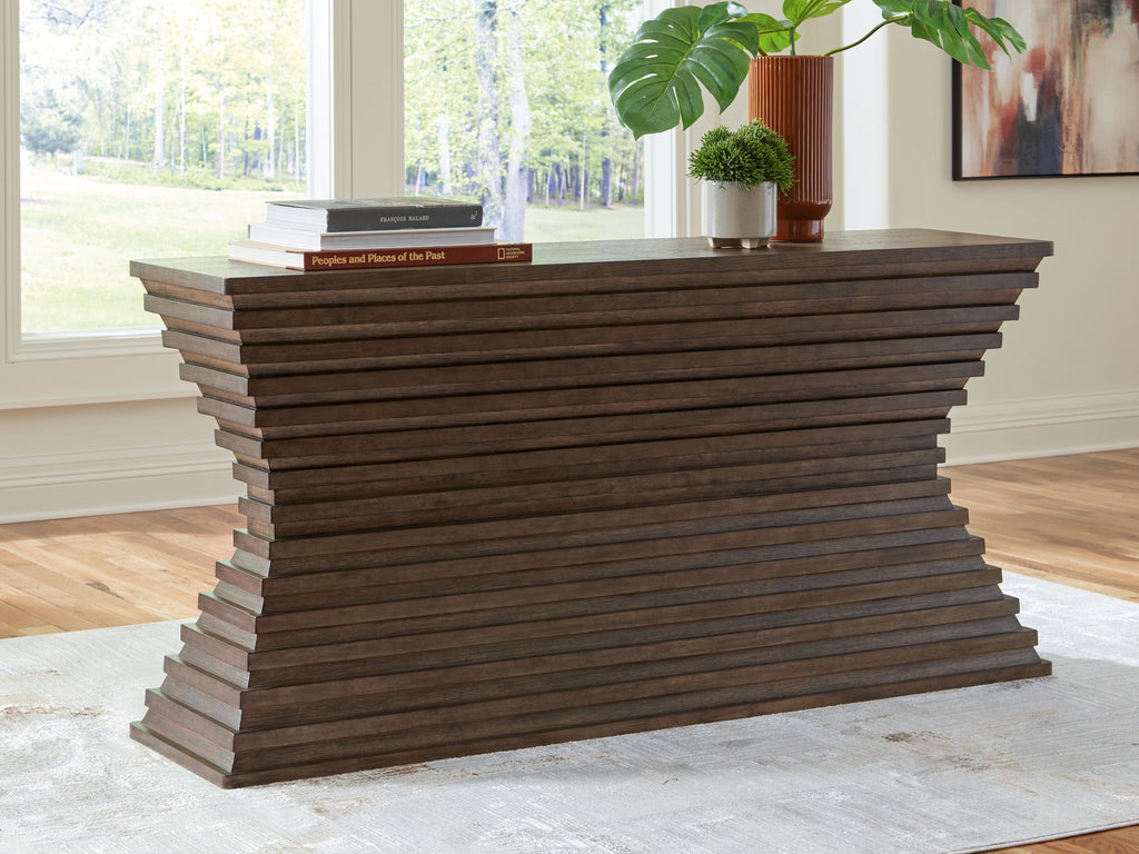 Warm brown sofa table with sculpted stacked sides and flat rectangular top