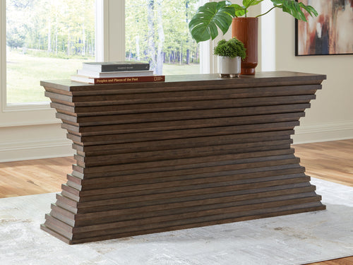 Warm brown sofa table with sculpted stacked sides and flat rectangular top