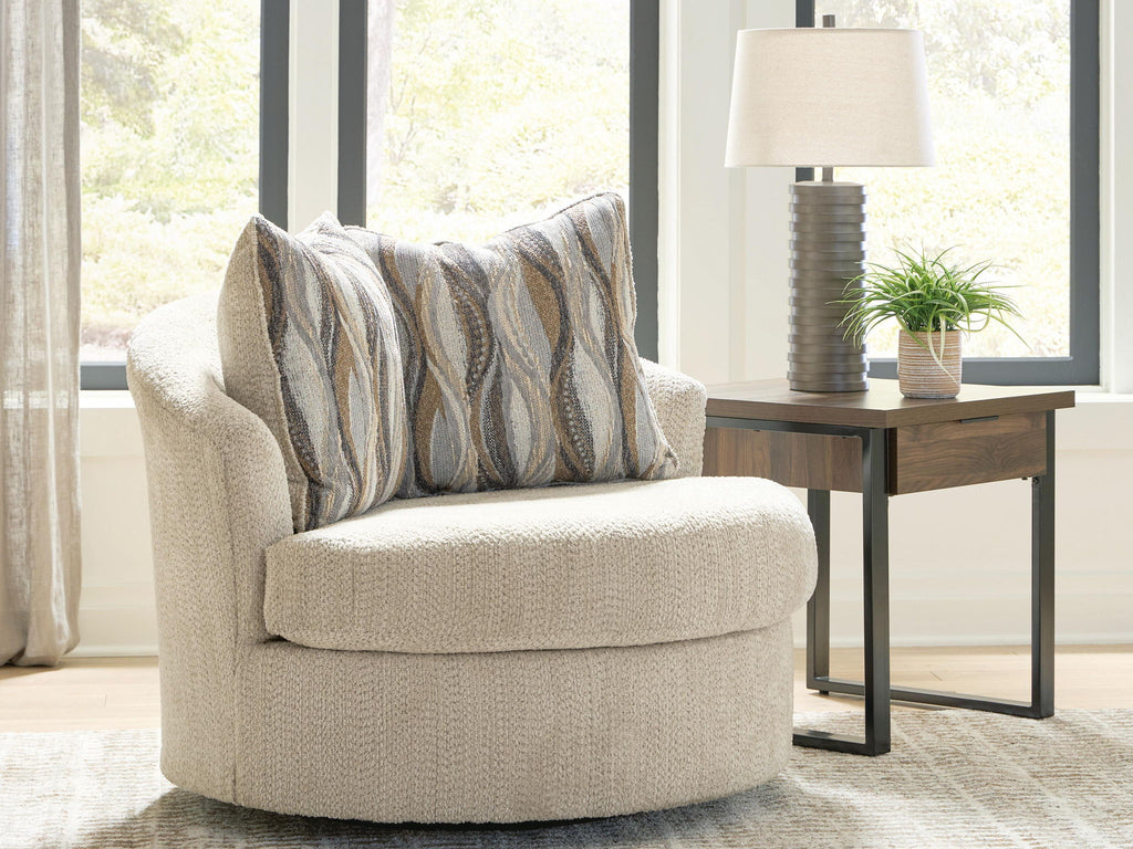 Beige swivel accent chair with upholstered arms and patterned pillows