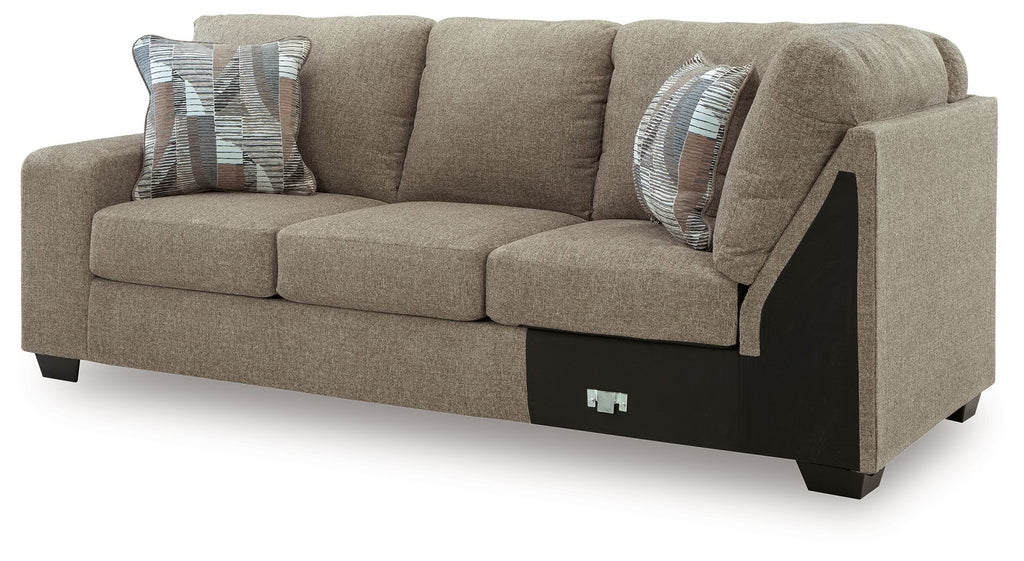 Newellen LAF sofa with corner wedge, beige fabric, rounded arms and dark base panel