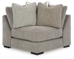 Aslan Court wedge sectional chair in light gray fabric with two pillows