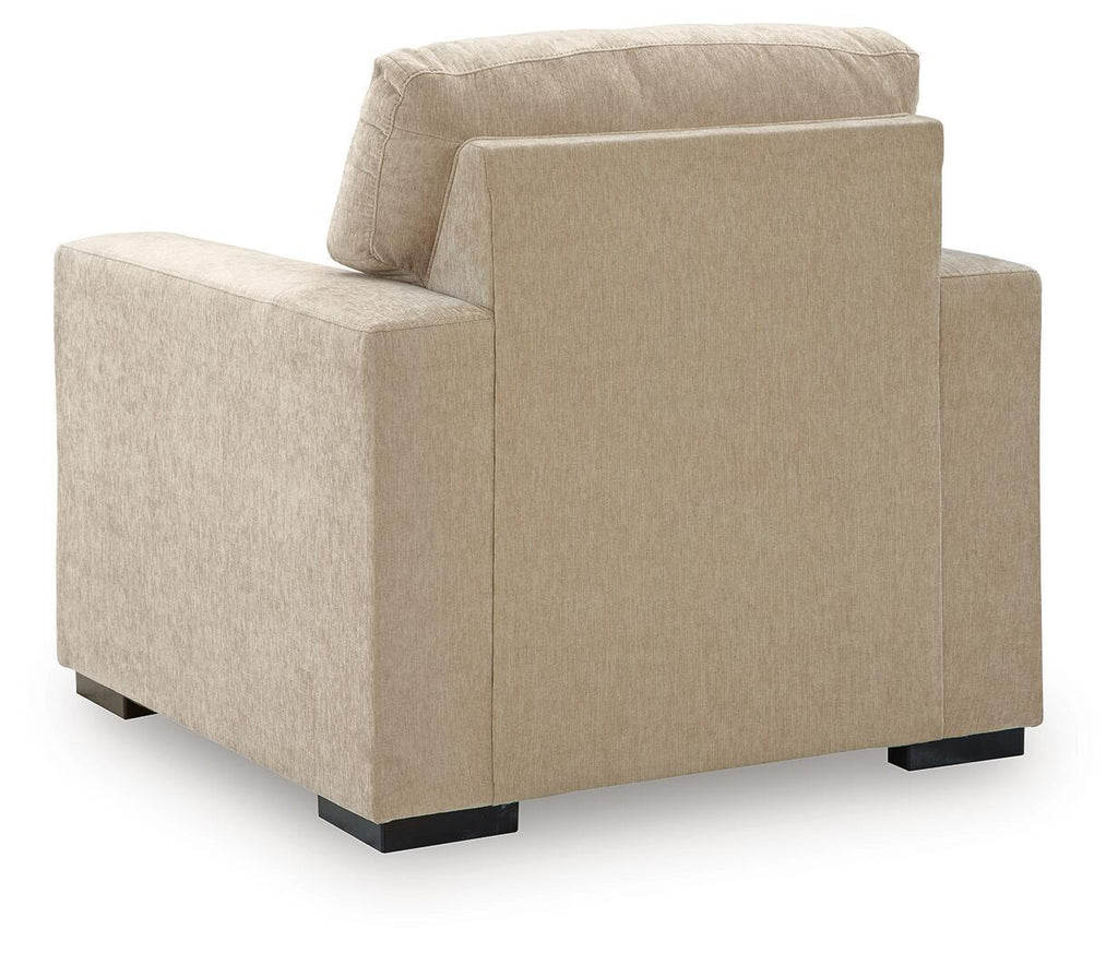 Light beige fabric accent chair, side view with tall backrest and squared arms.