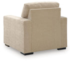 Light beige fabric accent chair, side view with tall backrest and squared arms.