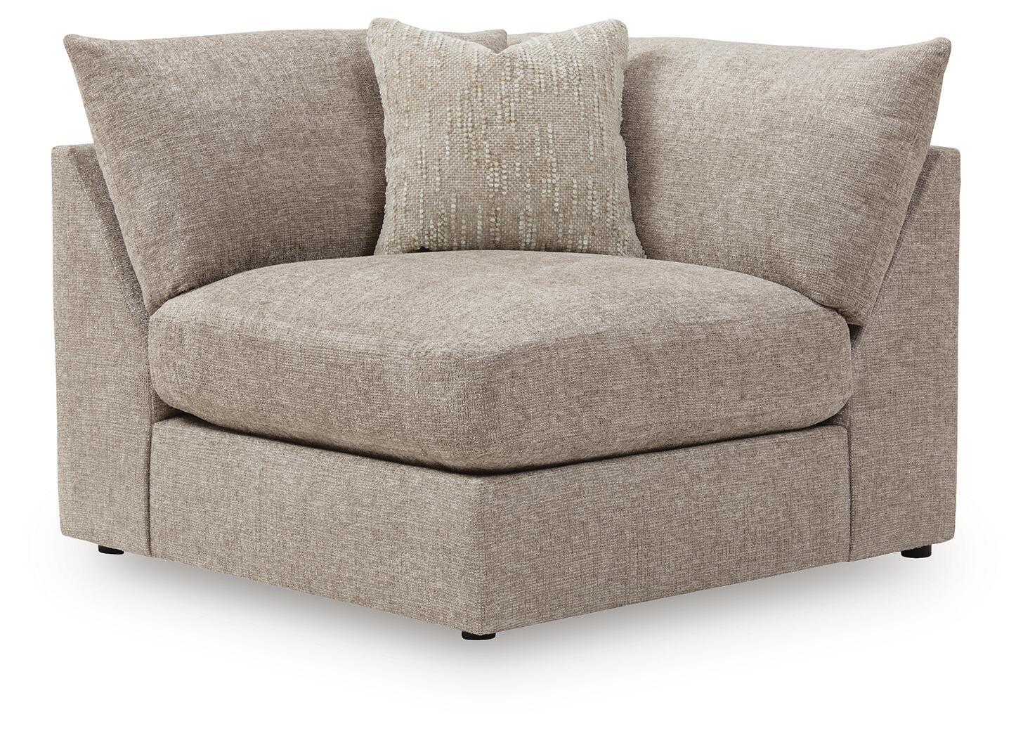 Upholstered wedge sofa with beige burlap-style throw pillow, light gray seat