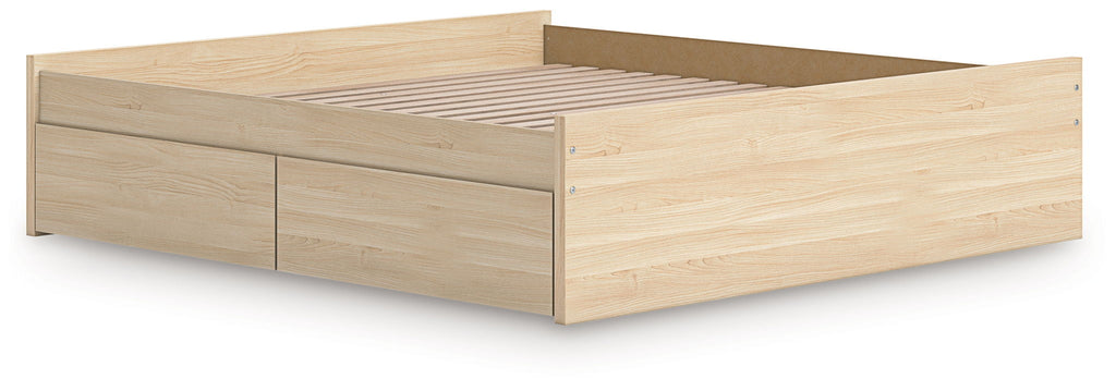 Platform bed with light brown wood frame and long front storage drawer