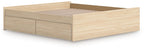 Platform bed with light brown wood frame and long front storage drawer