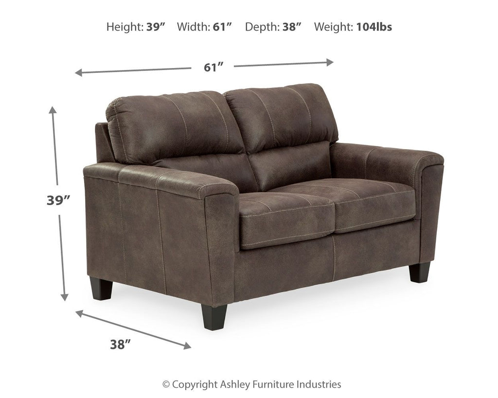 Smoke gray upholstered loveseat with tufted back cushions and padded seat, dark tapered legs