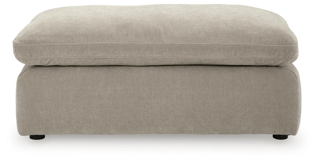 Light gray ottoman with smooth fabric upholstery and short legs
