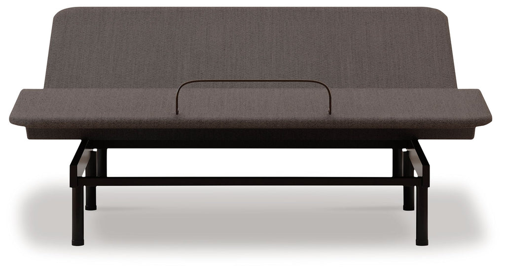 Adjustable bed base with dark upholstered head section and black frame, front view