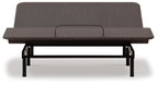 Adjustable bed base with dark upholstered head section and black frame, front view