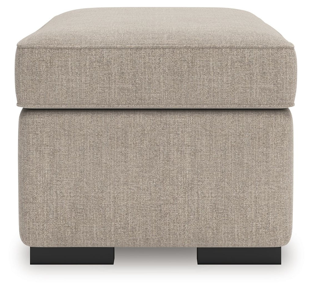 Heather fabric ottoman with rounded top and visible black feet