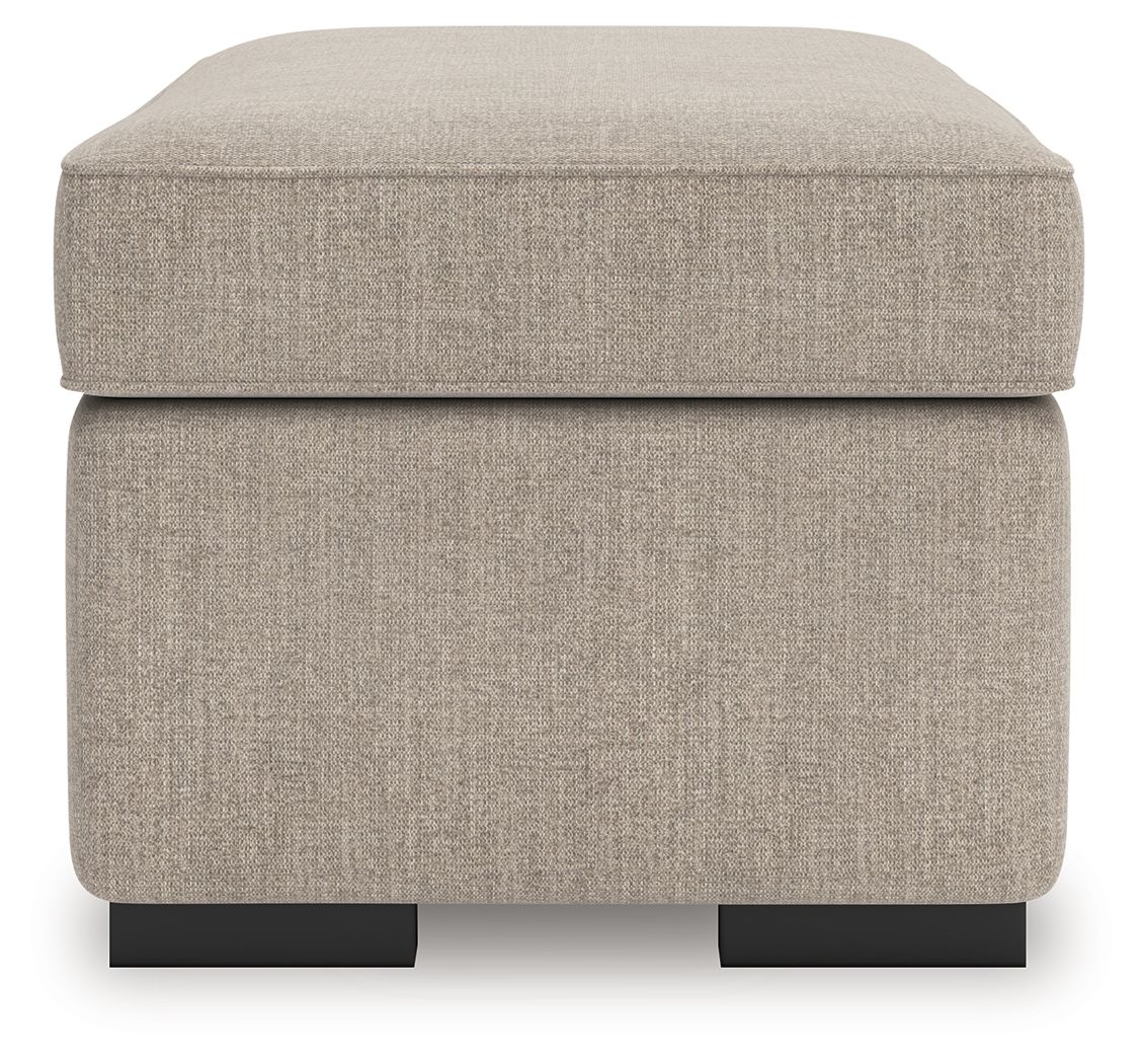 Heather fabric ottoman with rounded top and visible black feet