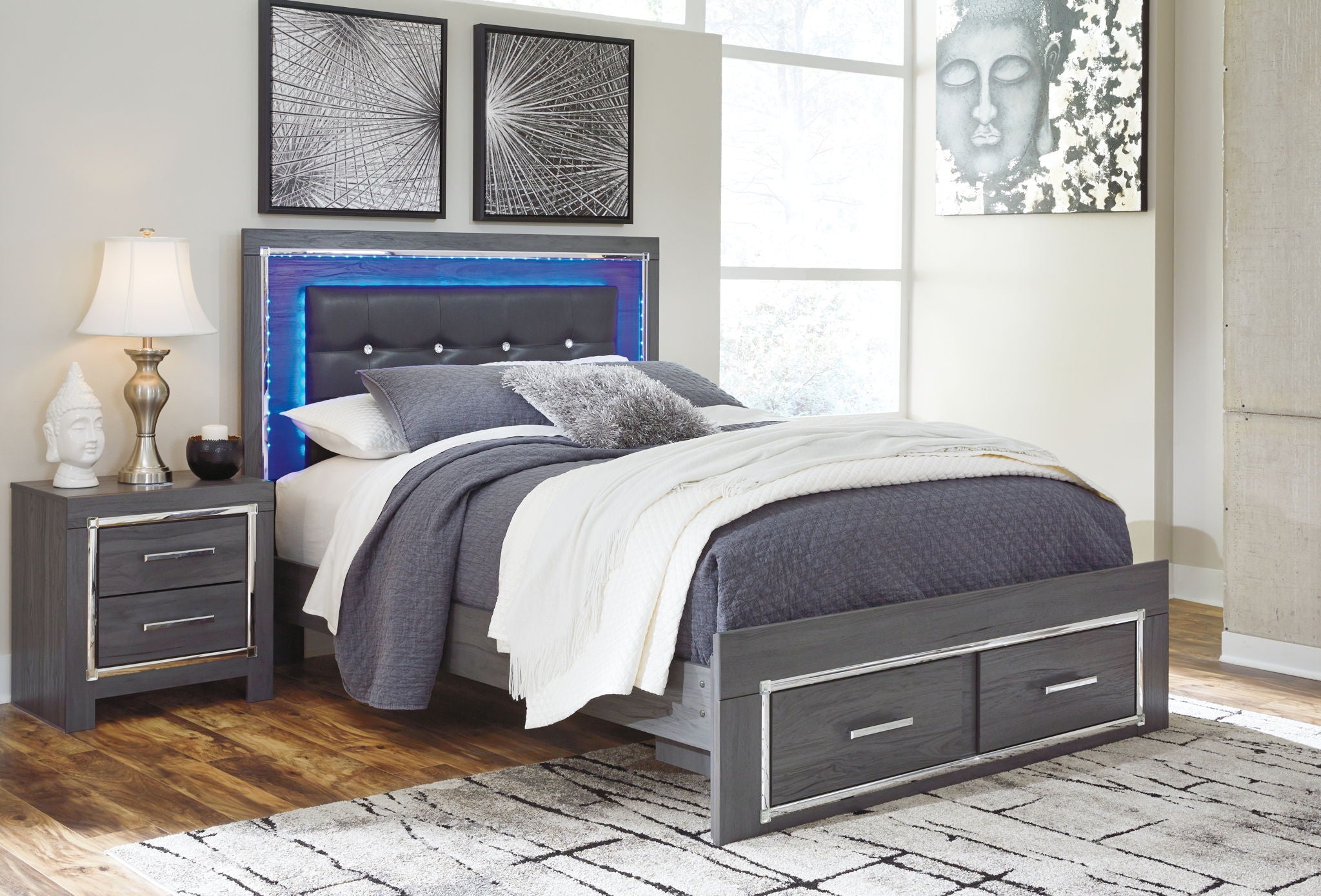 Gray upholstered panel bed with button-tufted headboard and two drawers