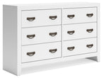 White dresser with multiple drawers and dark metal pull handles