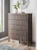 Brown five-drawer wide chest with four drawer fronts outlined by dark horizontal lines