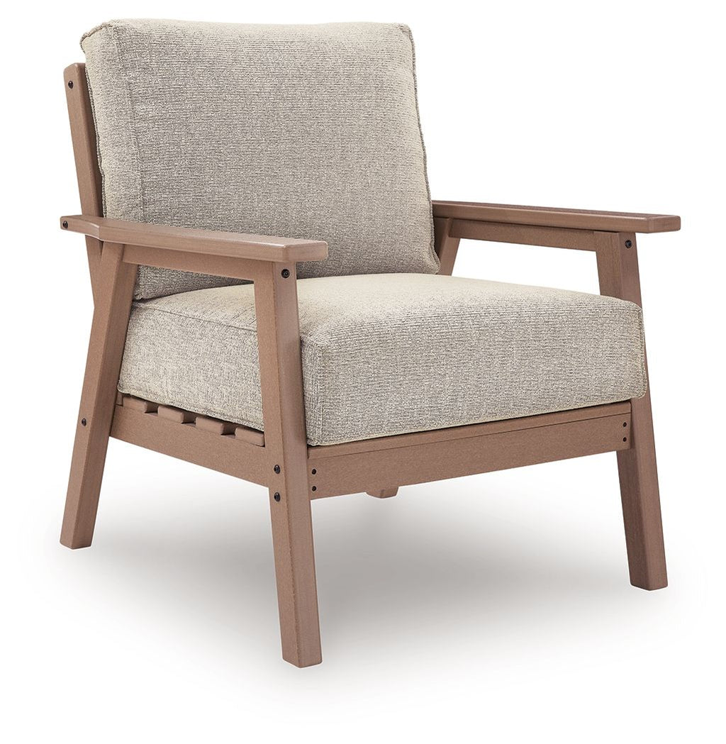 Single lounge chair with light beige fabric cushion and driftwood-finish wooden frame