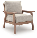 Single lounge chair with light beige fabric cushion and driftwood-finish wooden frame