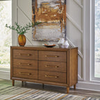 Brown wooden dresser with six drawers, brass bar pulls, and short tapered legs
