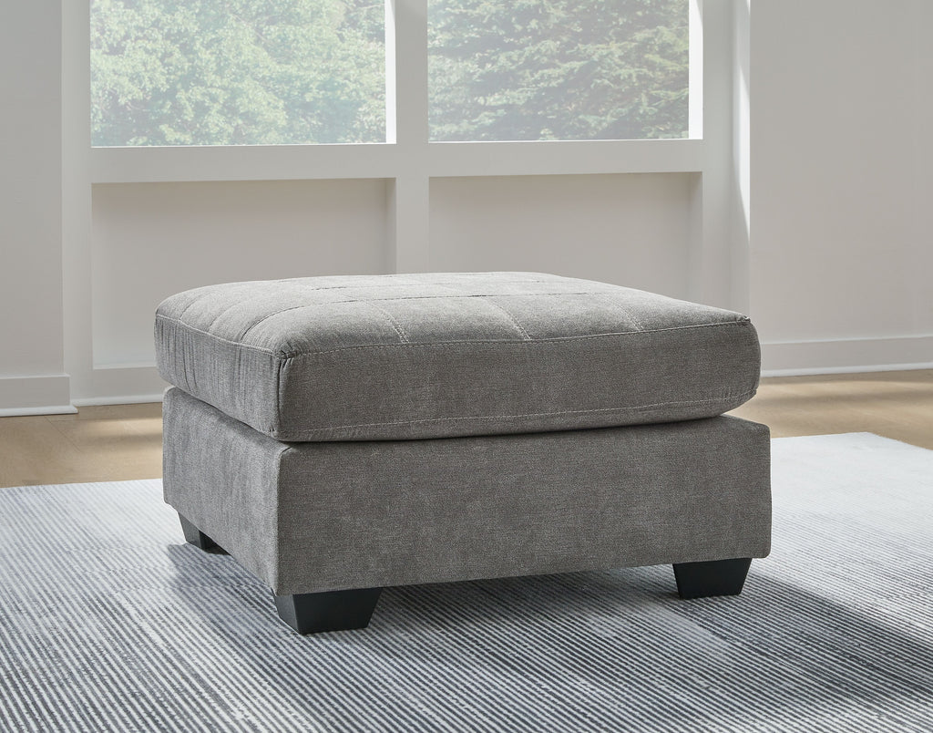 Oversized accent ottoman in gray fabric with low block legs and rounded top