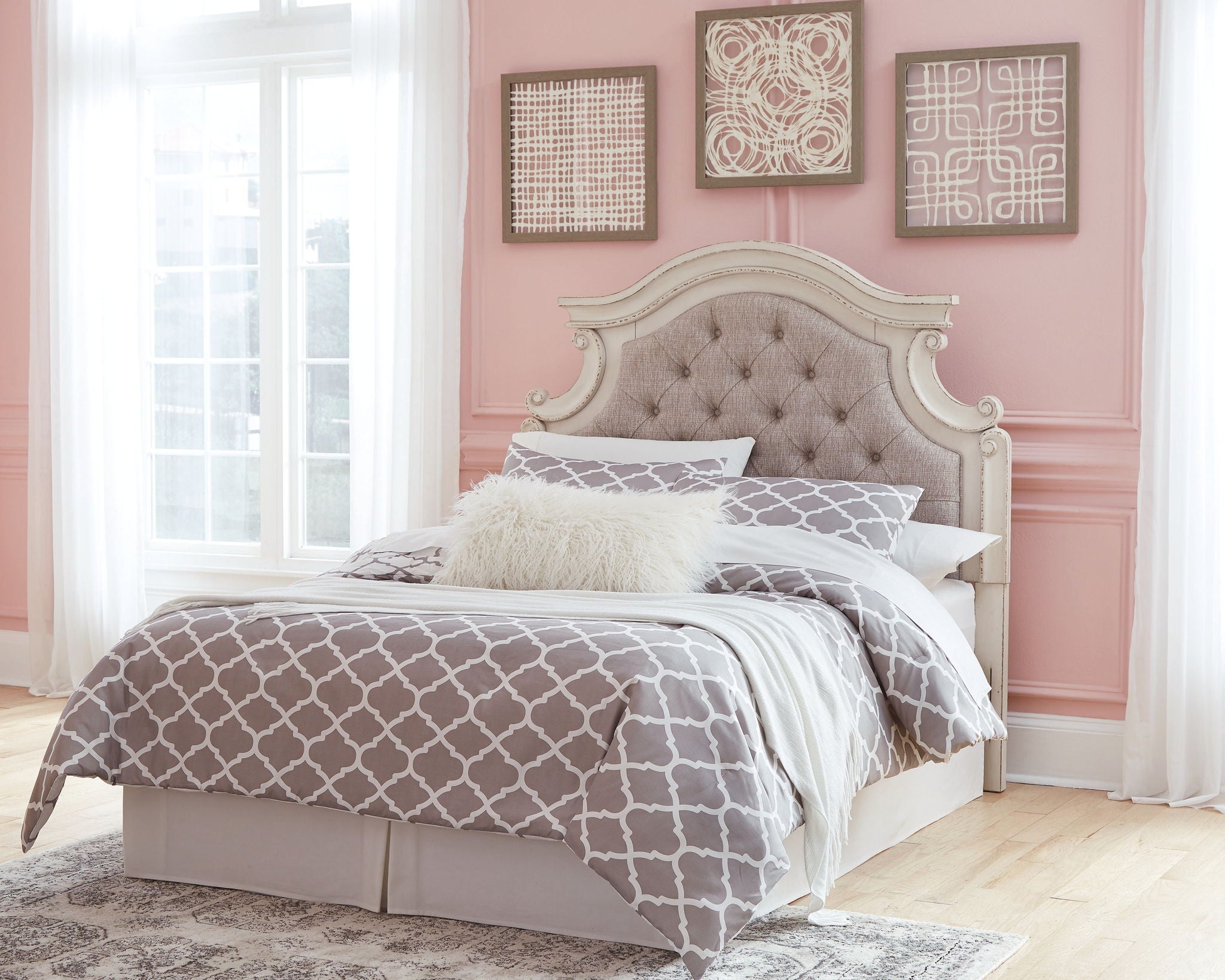 Tufted upholstered headboard in chipped white, shown with bedding and pillows