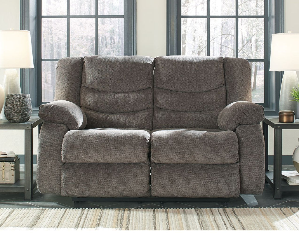 Gray reclining loveseat with two reclined seats and rounded armrests