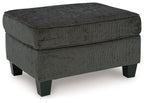 Dark charcoal ottoman with square top and stitched edges, sturdy wooden legs