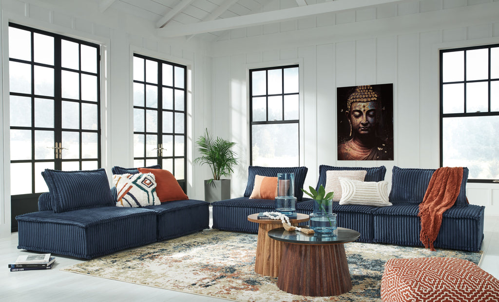 Navy modular sectional sofa with multiple cushions and chaise lounge