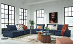 Navy modular sectional sofa with multiple cushions and chaise lounge