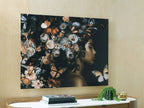 Floral wall art featuring a woman profile and butterflies in orange, black, and white