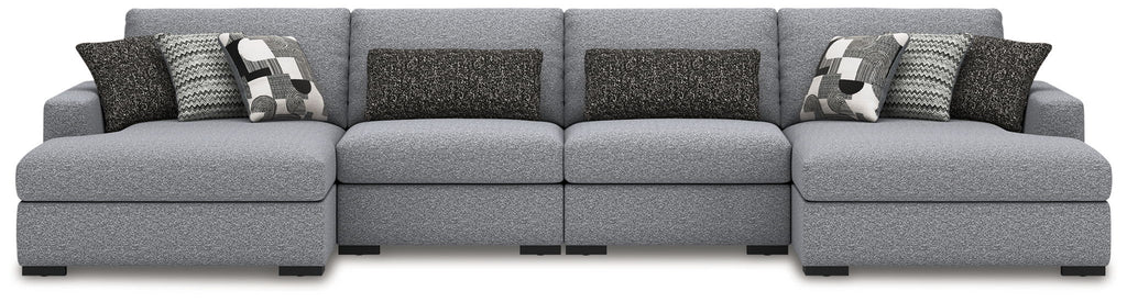 Gray sectional sofa with chaise extensions and two-pattern throw pillow set