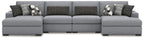Gray sectional sofa with chaise extensions and two-pattern throw pillow set