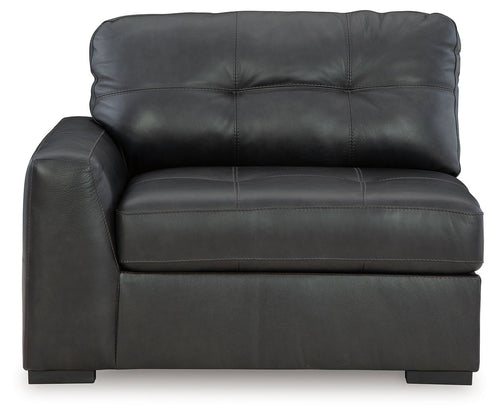 Gray corner chair with tufted back cushions and cushioned armrests