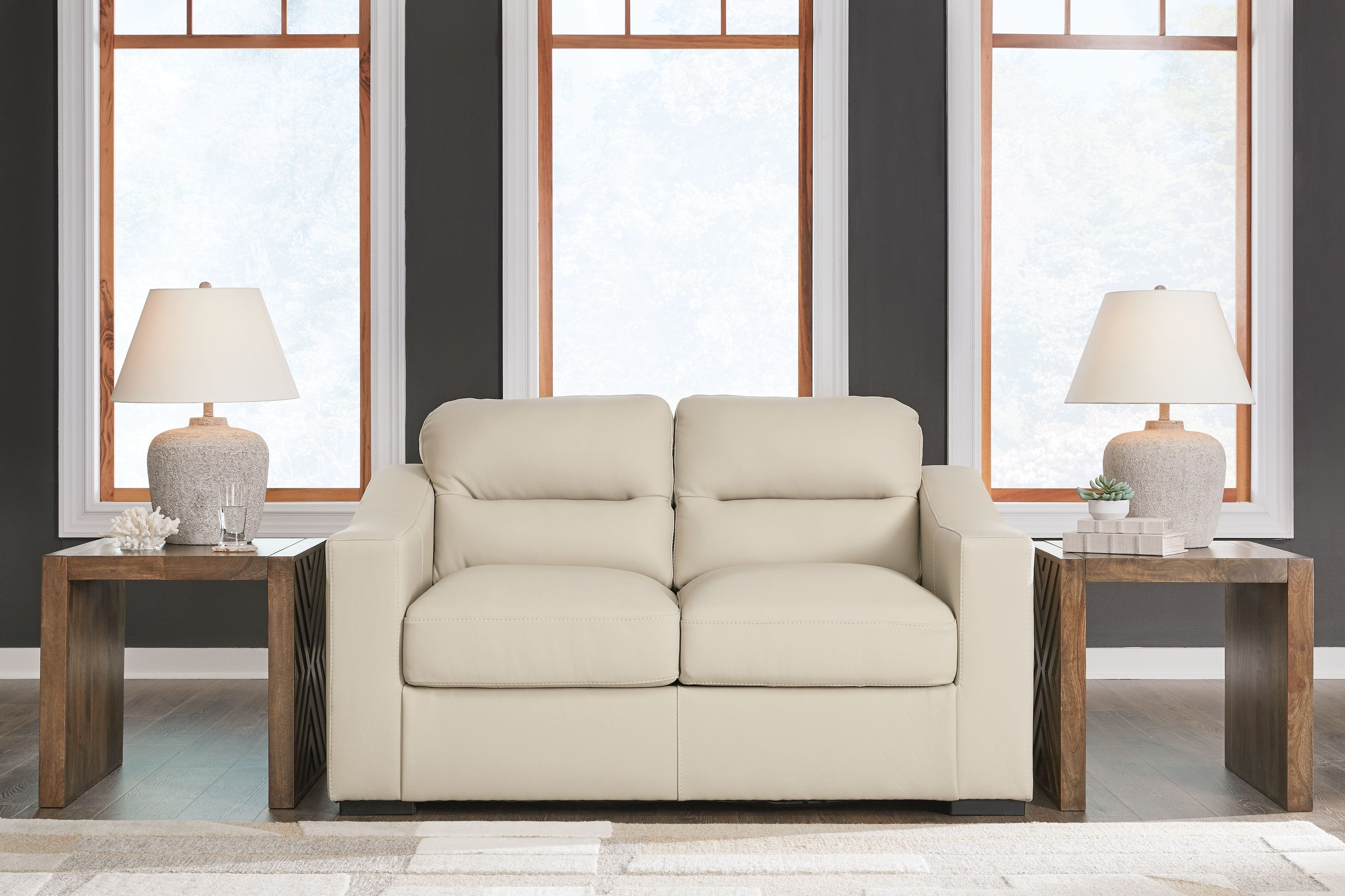 Almond loveseat with centered split seat and two-seat back cushions, padded arms
