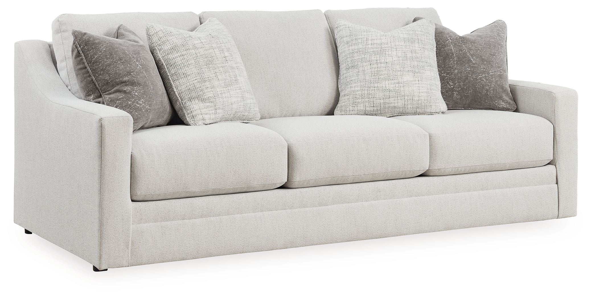 Chalk-colored sofa with three seat cushions and gray accent pillows