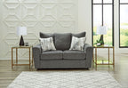 Dark gray fabric loveseat with two seat cushions and three back pillows.